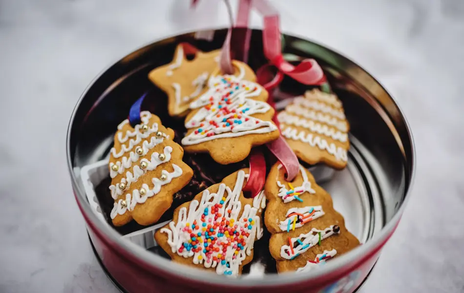 Plate with tasty Christmas cookies, gingerbread on snowy background with copy space for text. holiday, celebration and cooking concept. Happy new year and christmas. postcard.