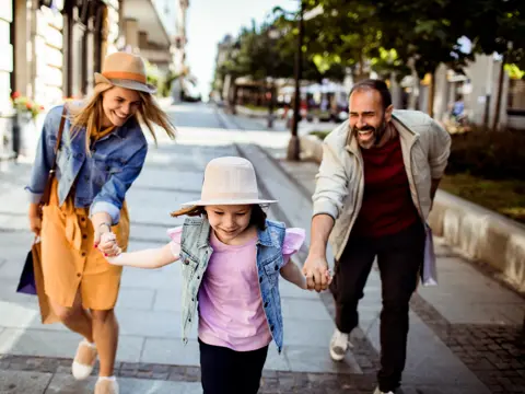 Close up of a Young family shopping in the city