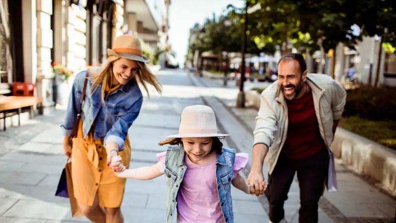 Close up of a Young family shopping in the city