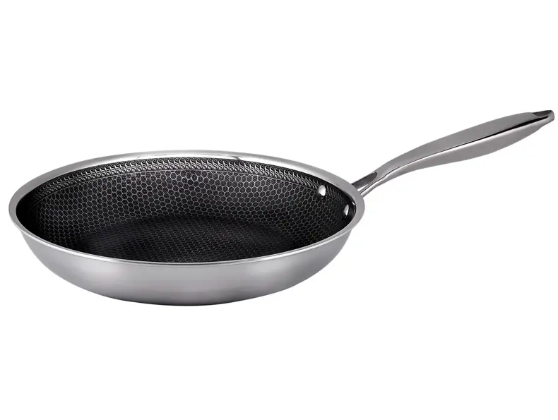 Stekepanne med mønstret stekeflate i rustfritt stål.