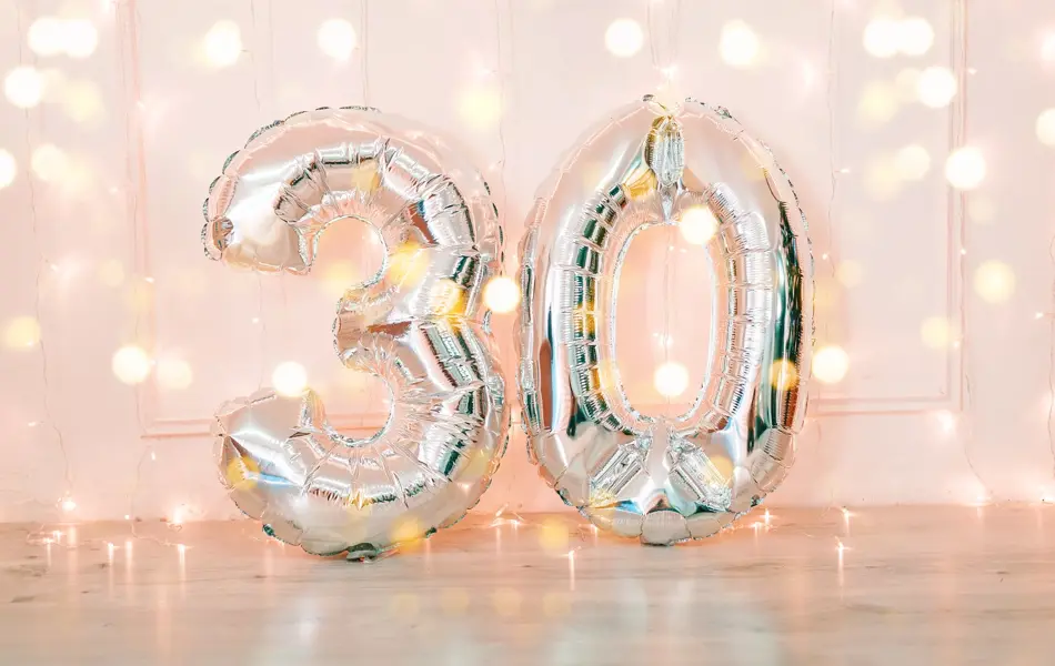 Silver foil birthday balloons number 30 with glitter lights. Birthday concept.