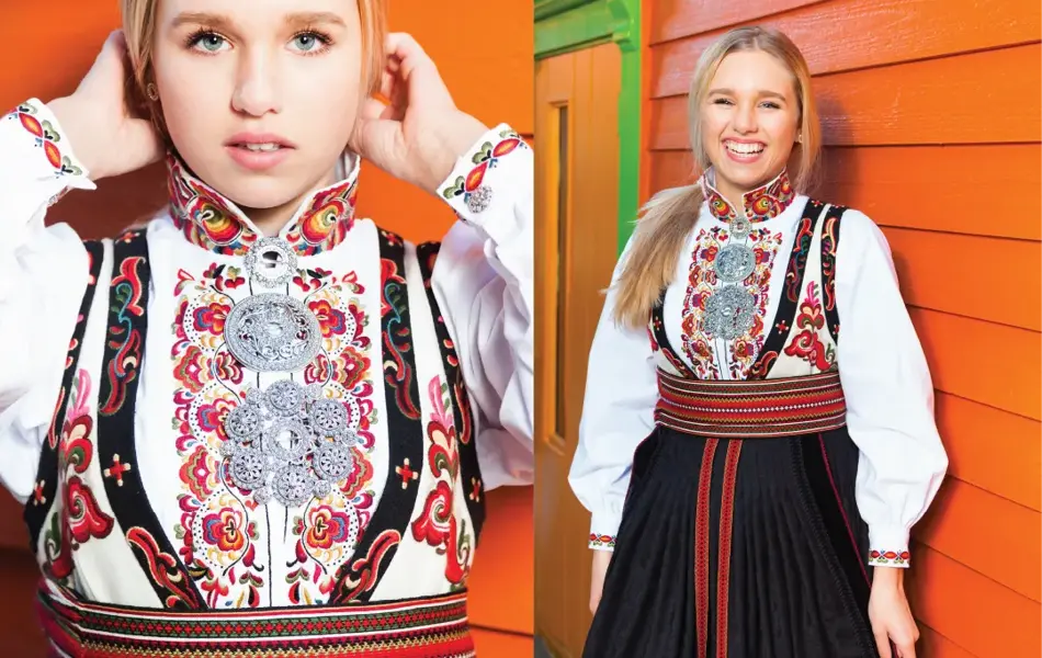 Jente i rød og svart bunad