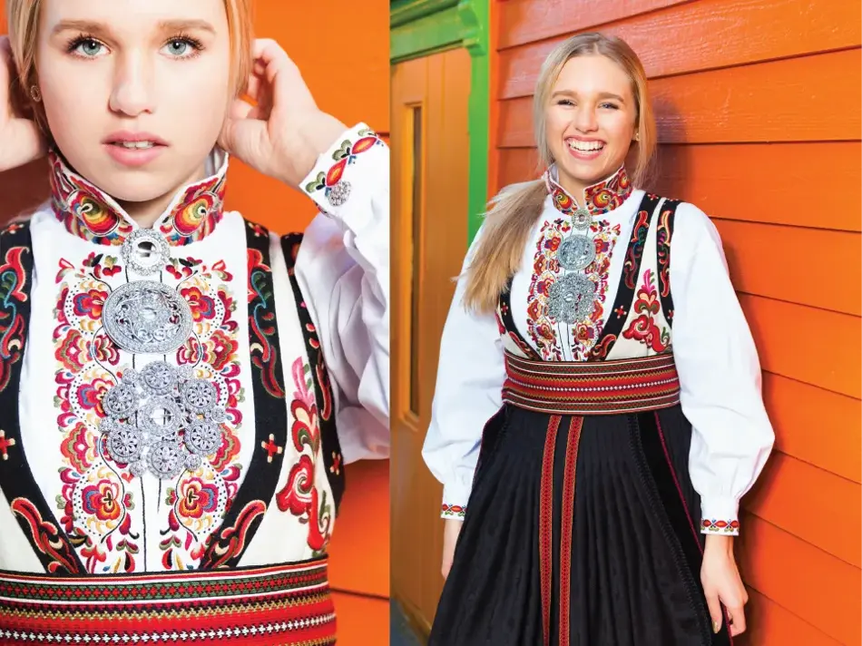 Jente i rød og svart bunad