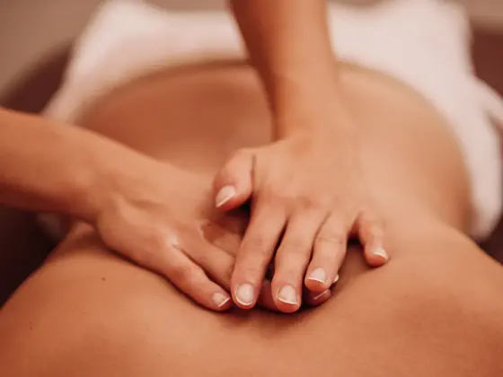 woman getting a back massage at a spa 
Photo taken indoors with stobe light