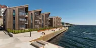 Bildet viser fasaden på boligprosjektet Lehmanns Brygge i Drøbak.