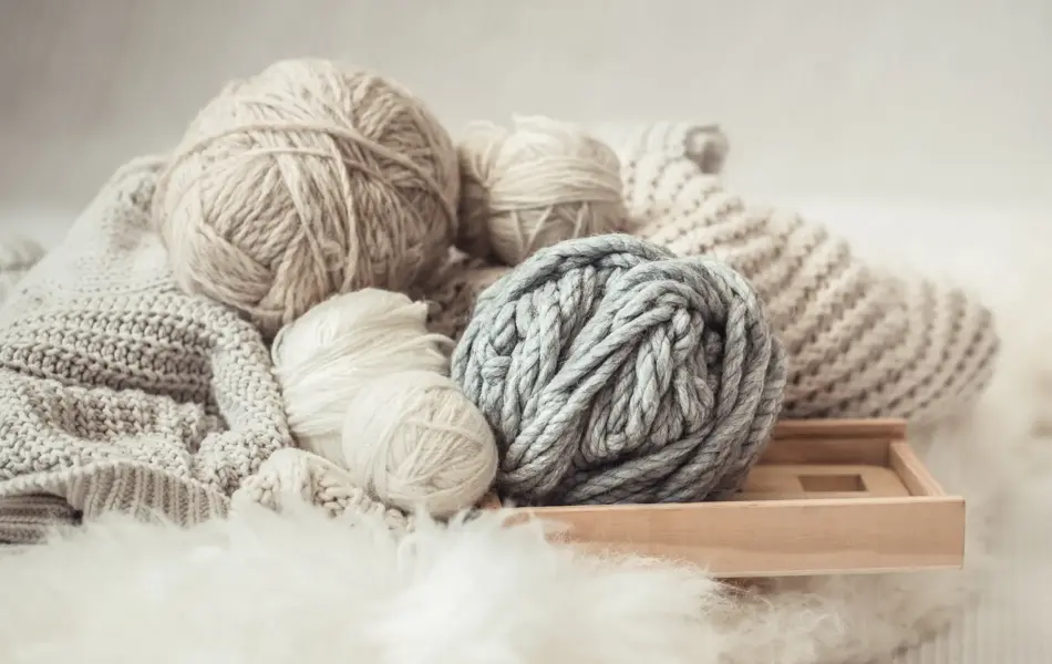 cozy background Wallpaper with a variety of threads for knitting. Close up.