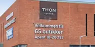 Fasadebilde av Thon Senter Borg, logo på vegg.